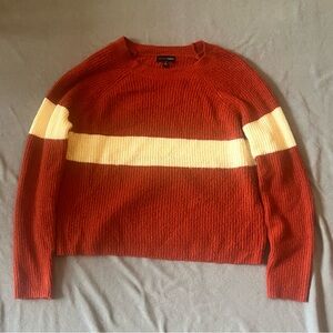 Dark orange sweater with solid white stripes